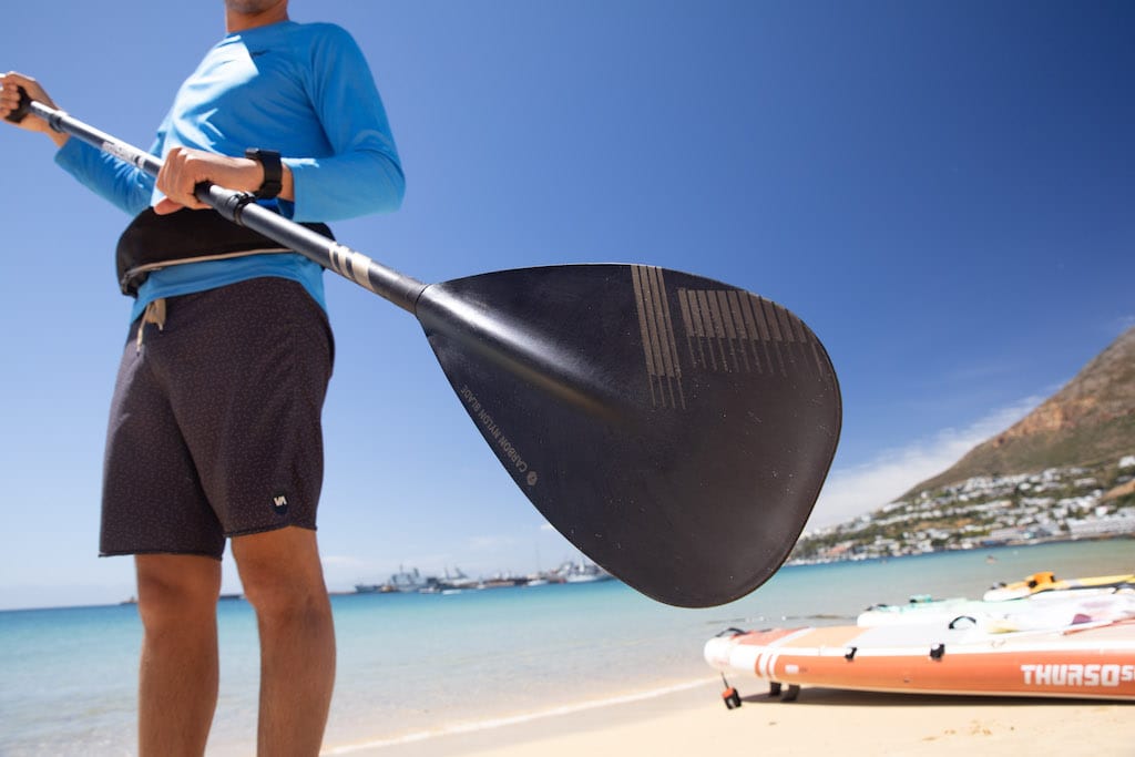 Man holding a Thurso Surf SUP paddle