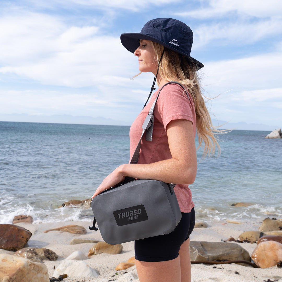 Woman holding a slate bag with &