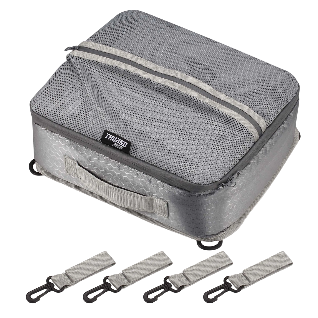 Gray travel packing cube with straps on a white background