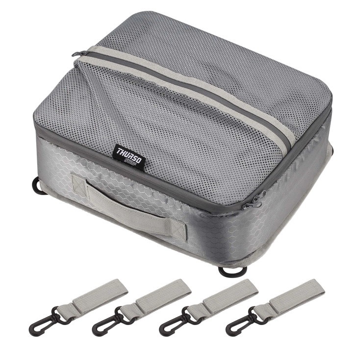 Gray travel packing cube with straps on a white background